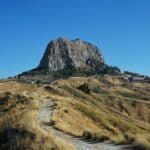 gray rocky mountain under blue sky during daytime